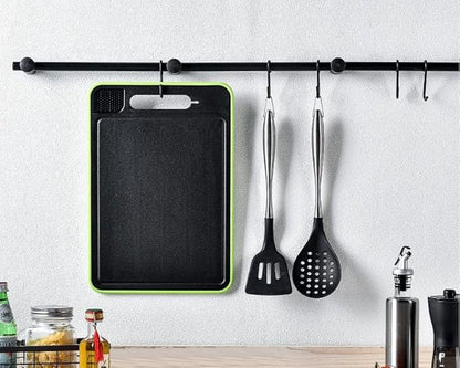 Hanging 4 in 1 chopping board with kitchen utensils on a wall rack for organized storage.